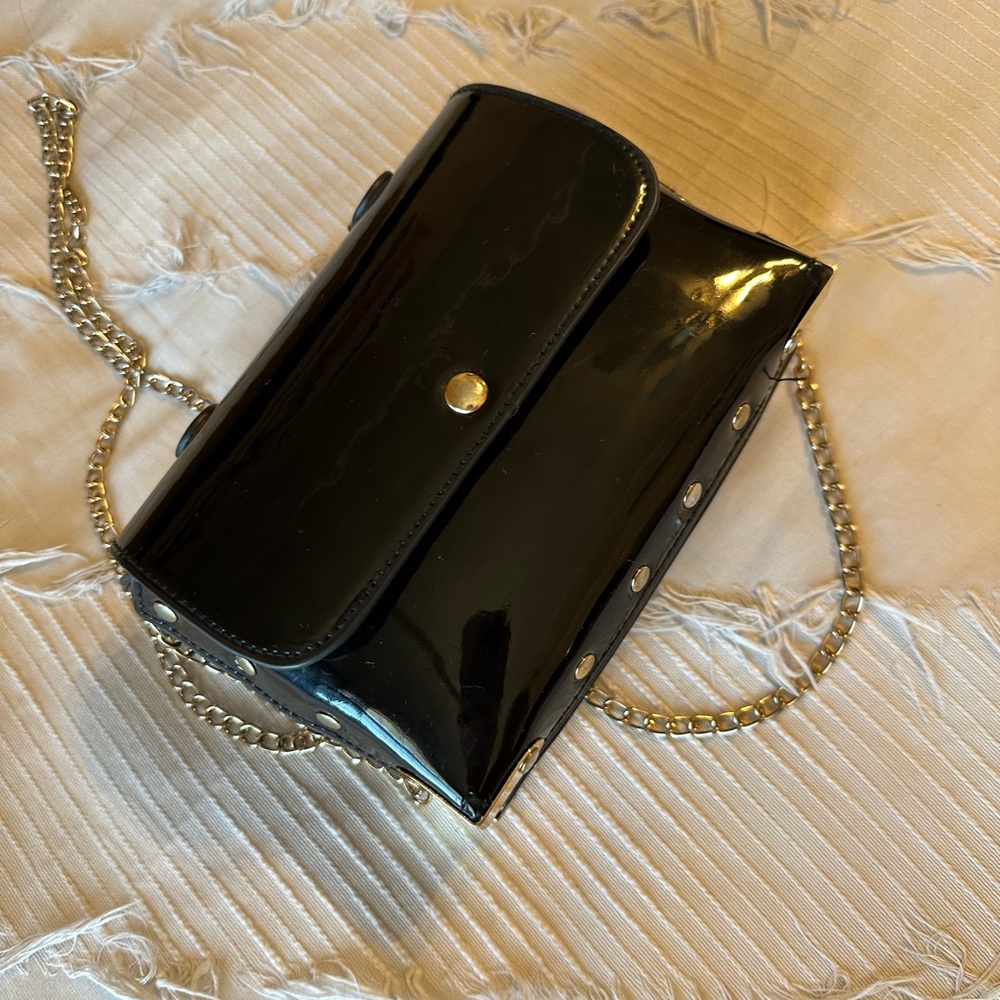 Patent black faux leather bag with gold hardware
